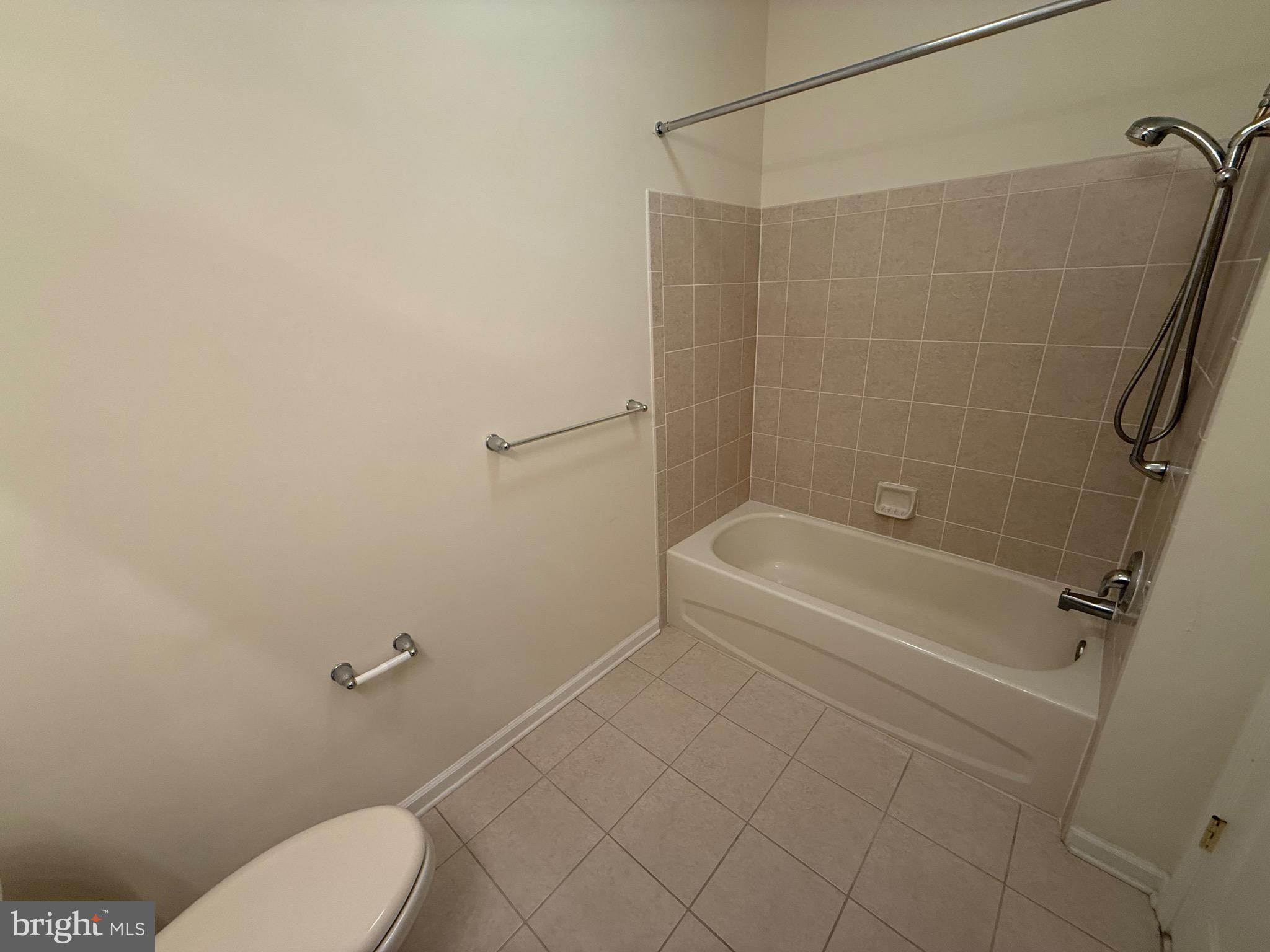 231 Masterson Court Ewing, NJ 08618 - Photo 28 of 43 a white bath tub sitting next to a white toilet