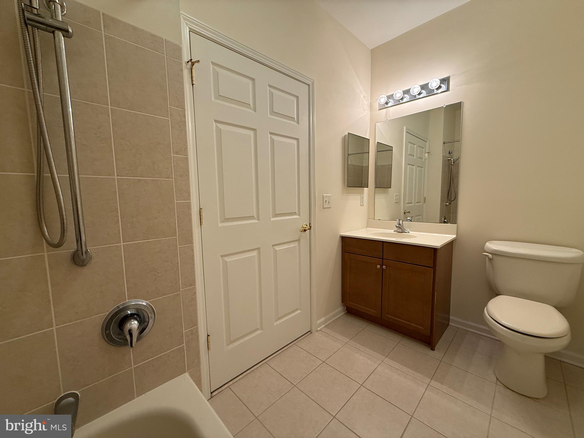 231 Masterson Court Ewing, NJ 08618 - Photo 29 of 43 a bathroom with a toilet a sink a mirror a shower and vanity