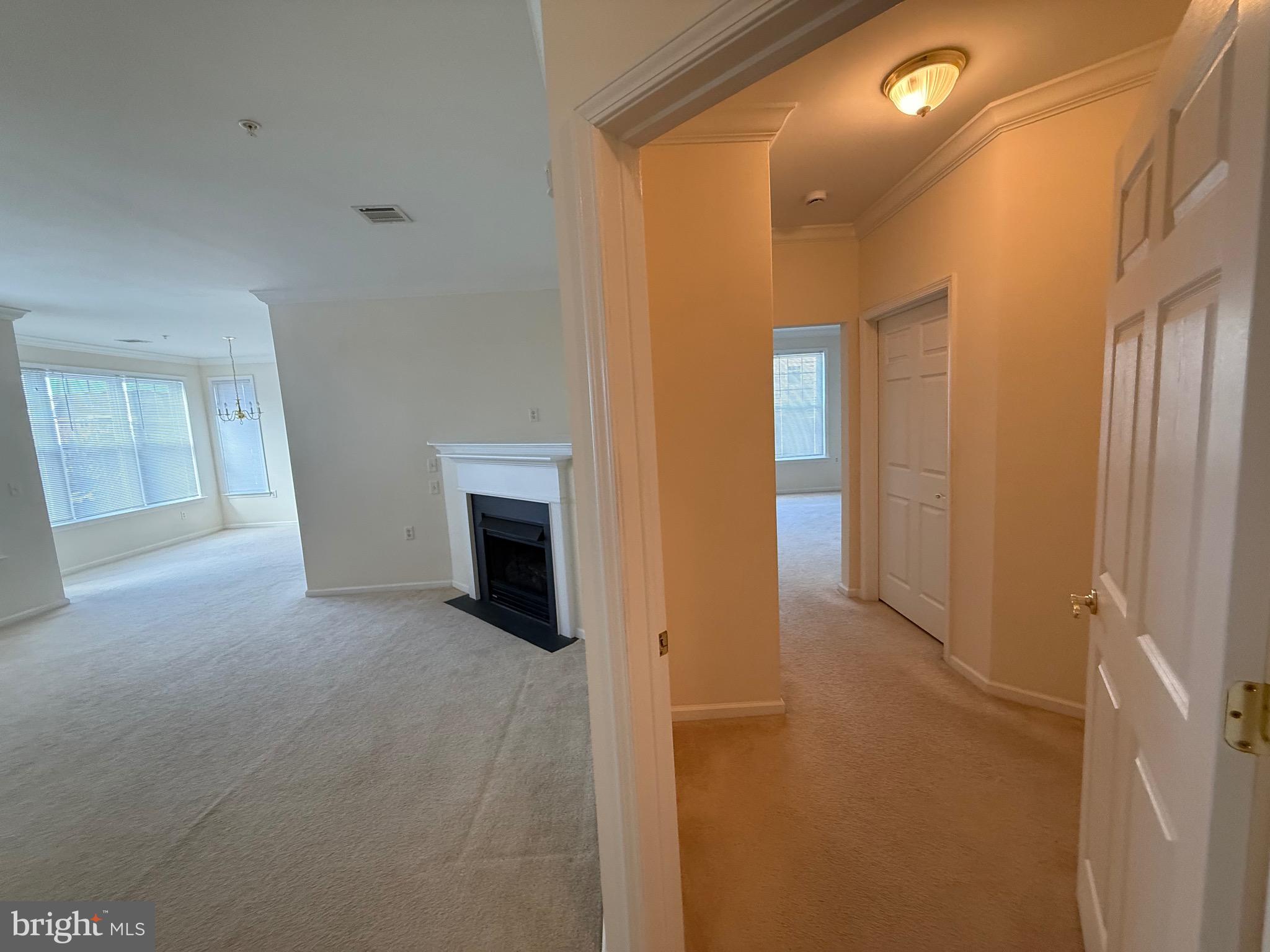231 Masterson Court Ewing, NJ 08618 - Photo 36 of 43 a view of a hallway with wooden floor and a bathroom