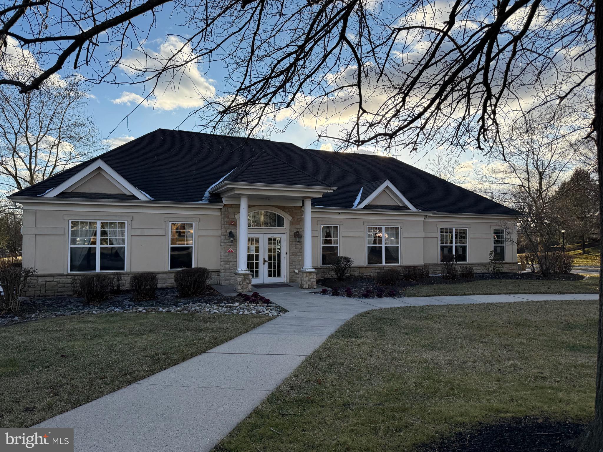 231 Masterson Court Ewing, NJ 08618 - Photo 40 of 43 a front view of a house with a yard