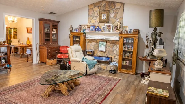 a kitchen with cabinets and refrigerator