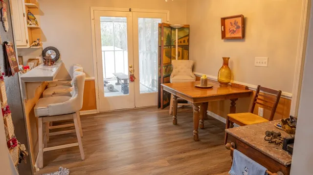 a bathroom with a sink and a stove next to a window