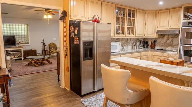 a view of a workspace with furniture