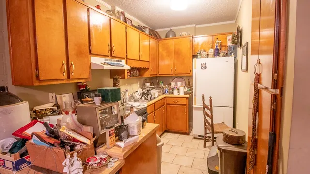 a view of a patio with table and chairs under an umbrella