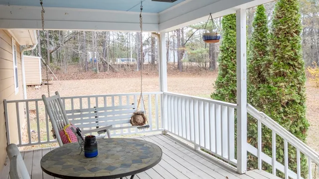 a living room filled with furniture hardwood floor and a window