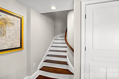 a view of entryway with stairs and wooden floor