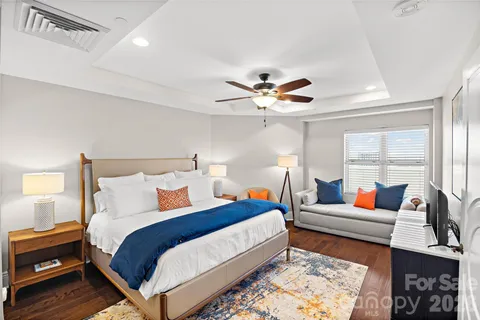 a bedroom with bed and window