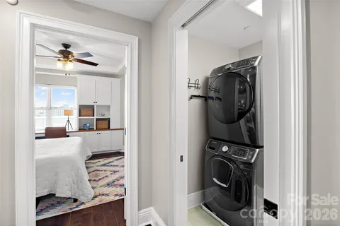 a view of a hallway with washer and dryer