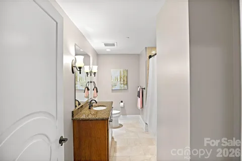 a view of a hallway with furniture and entryway