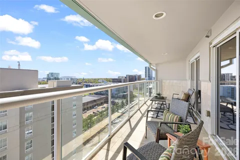 a view of balcony with furniture
