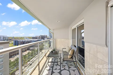a view of balcony with furniture