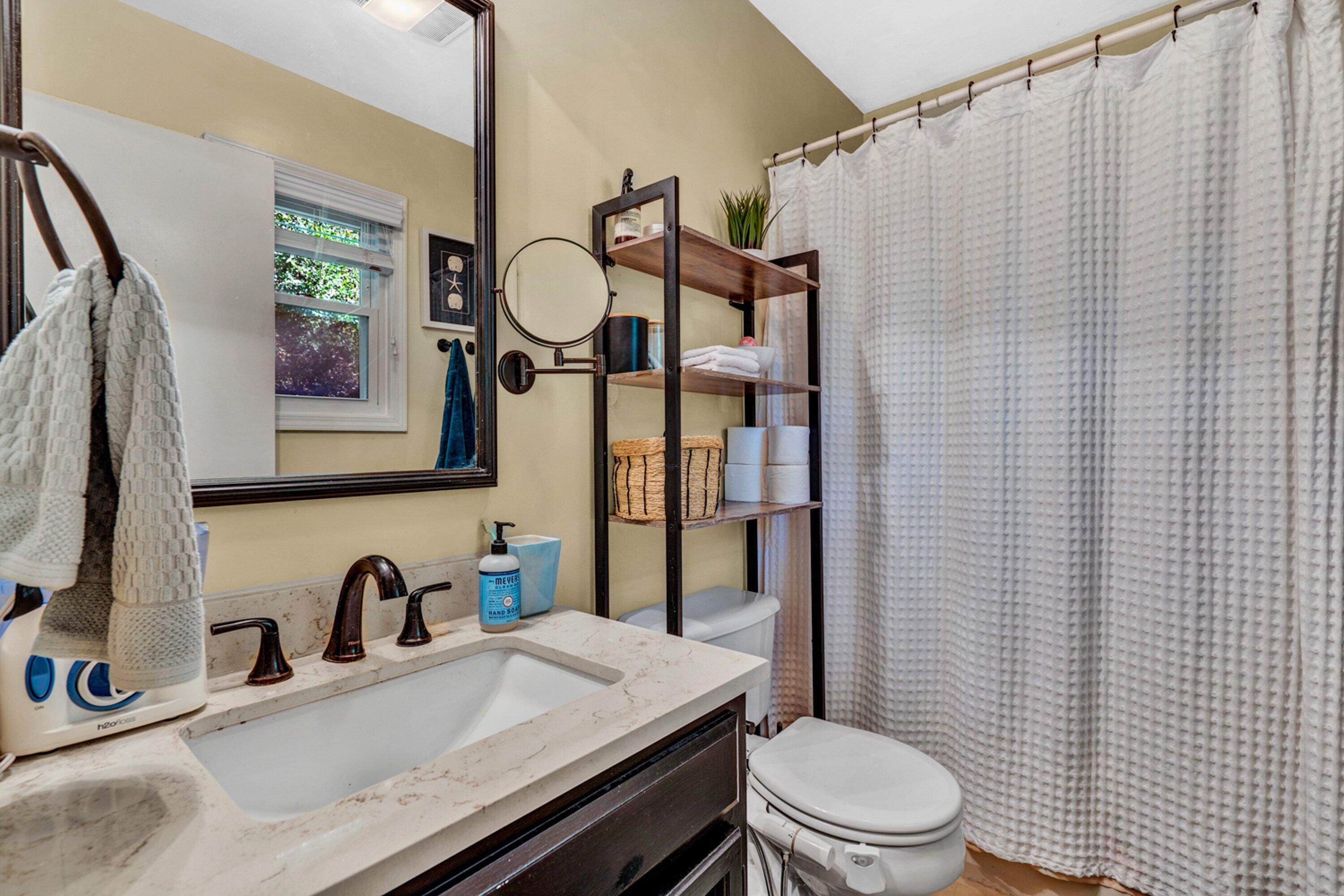 5606 MOUNT LAUREL Road Roanoke, VA 24018 - Photo 16 of 25 a bathroom with a granite countertop sink mirror vanity and toilet