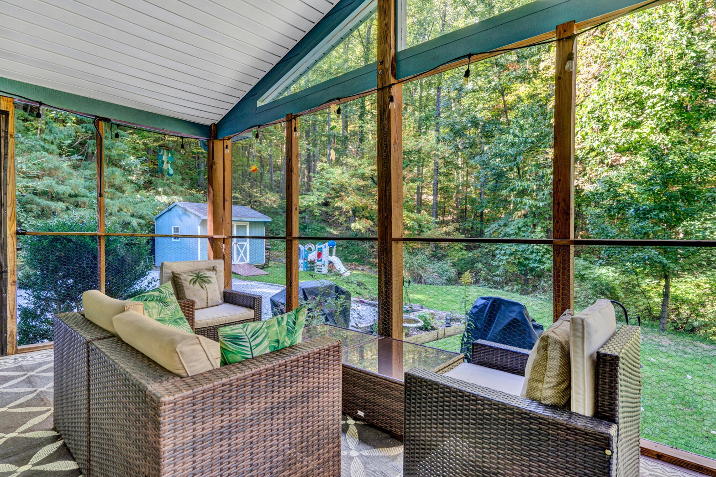 5606 MOUNT LAUREL Road Roanoke, VA 24018 - Photo 20 of 25 a living room with patio furniture and a floor to ceiling window