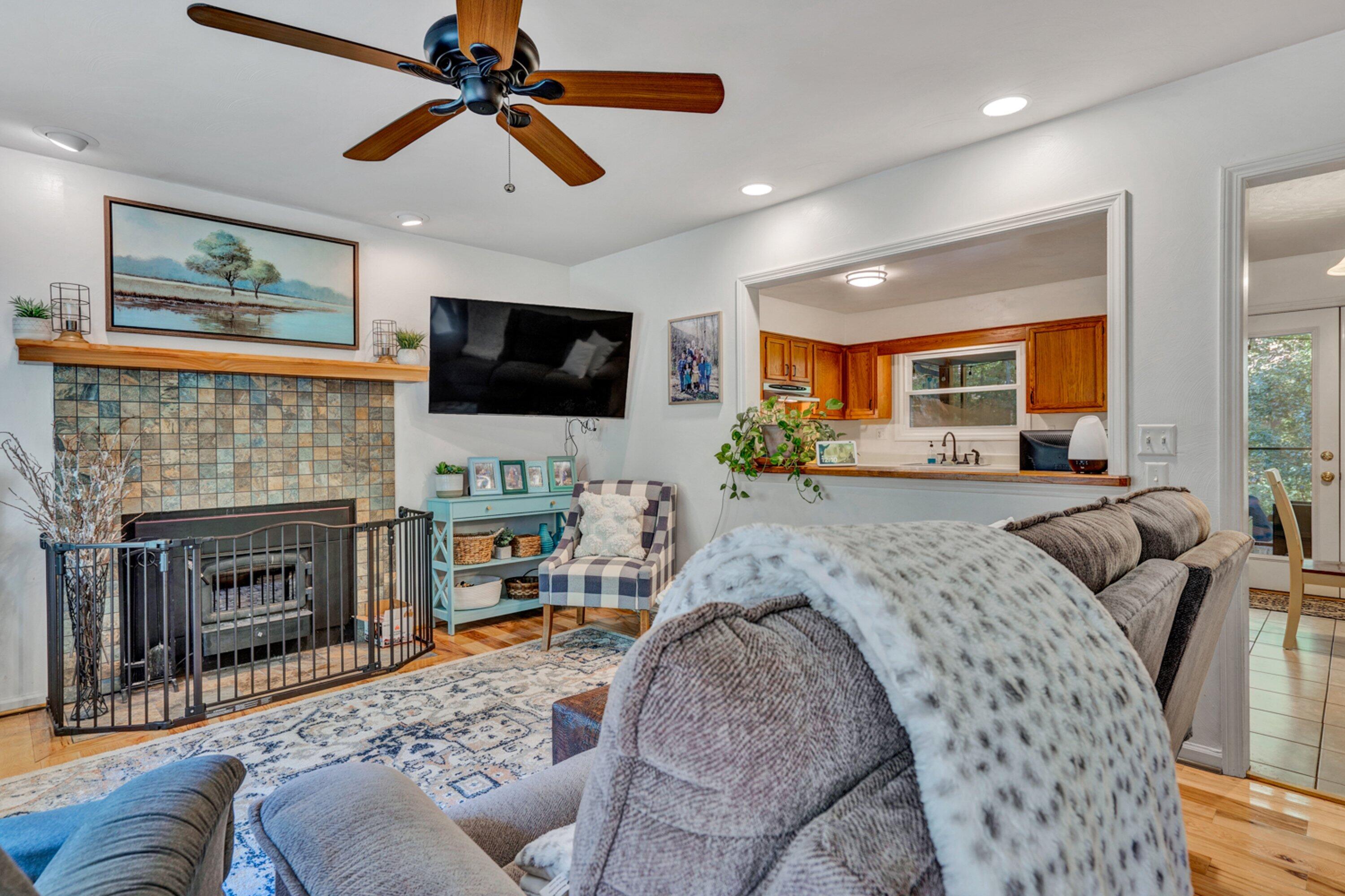 5606 MOUNT LAUREL Road Roanoke, VA 24018 - Photo 4 of 25 a living room with furniture a flat screen tv and a fireplace