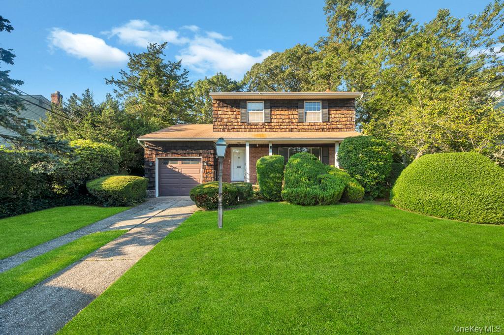 17 Wayne Place Commack, NY 11725 - Photo 1 of 1 a front view of a house with garden