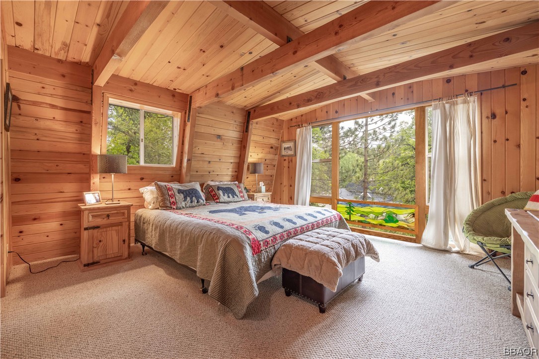 43527 Shasta Road Big Bear Lake, CA 92315 - Photo 13 of 25 a bed sitting in a spacious bedroom next to a window