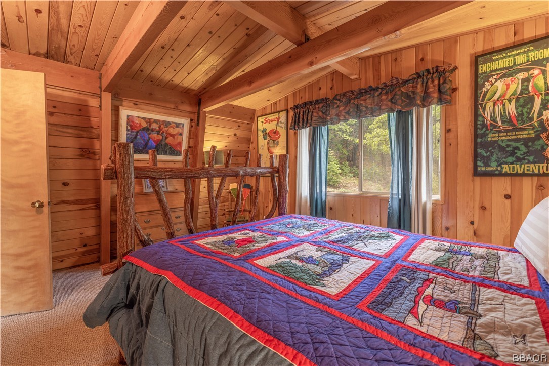 43527 Shasta Road Big Bear Lake, CA 92315 - Photo 17 of 25 a bed sitting in a bedroom next to a window