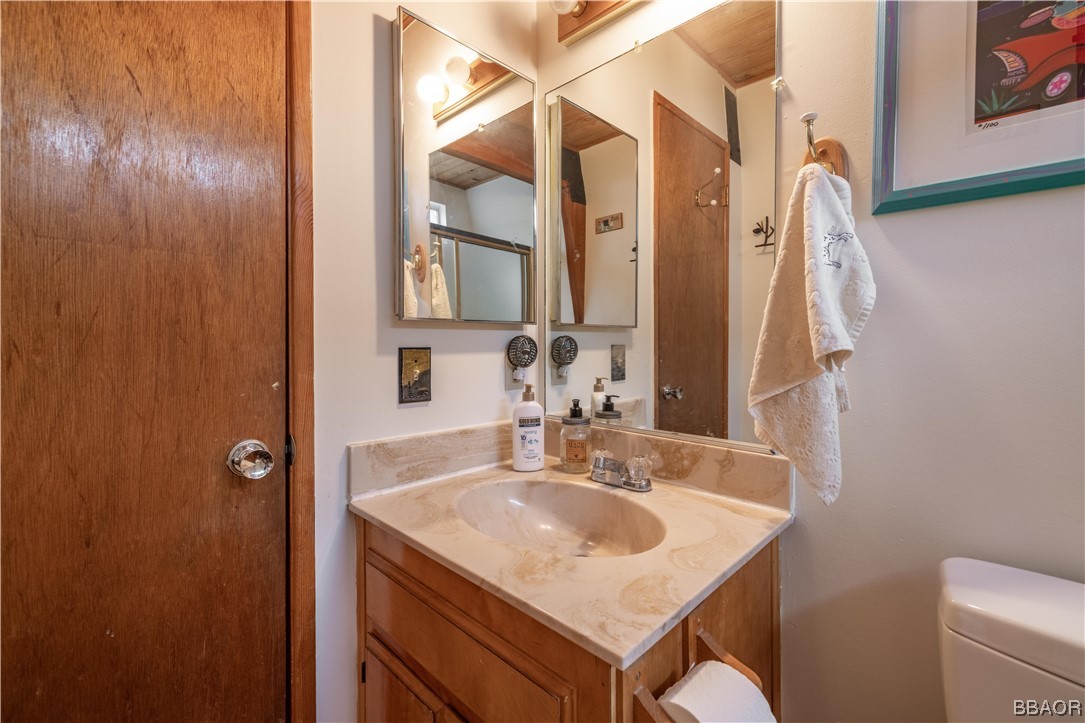43527 Shasta Road Big Bear Lake, CA 92315 - Photo 18 of 25 a bathroom with a sink toilet and shower