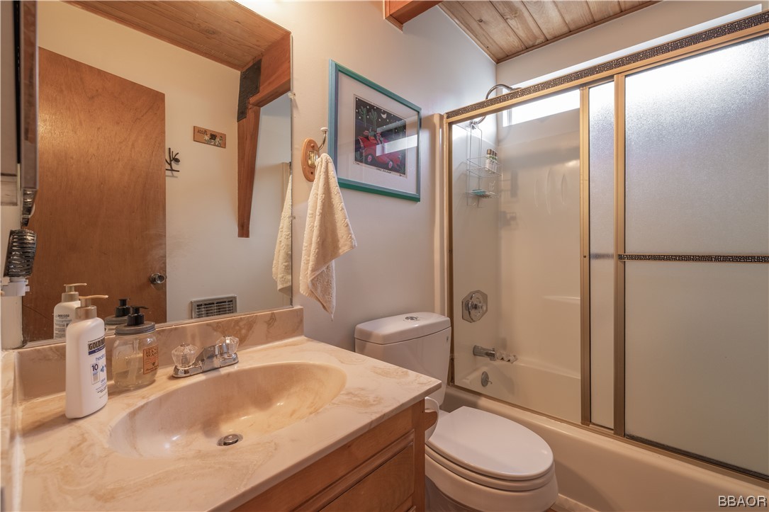 43527 Shasta Road Big Bear Lake, CA 92315 - Photo 19 of 25 a bathroom with a sink a toilet and shower
