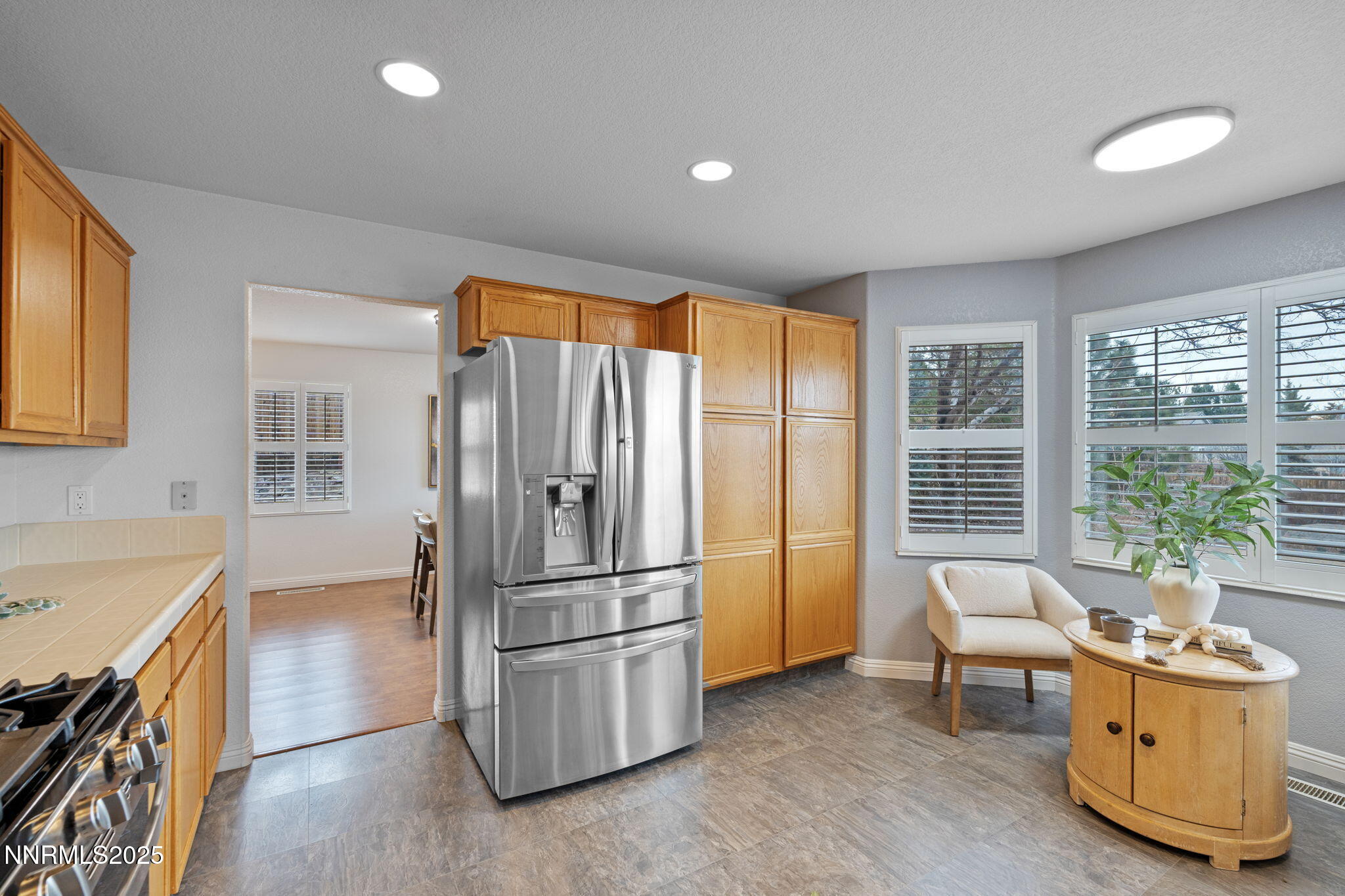 485 Corvallis Court Reno, NV 89511 - Photo 11 of 34 a kitchen with stainless steel appliances granite countertop a refrigerator and a sink