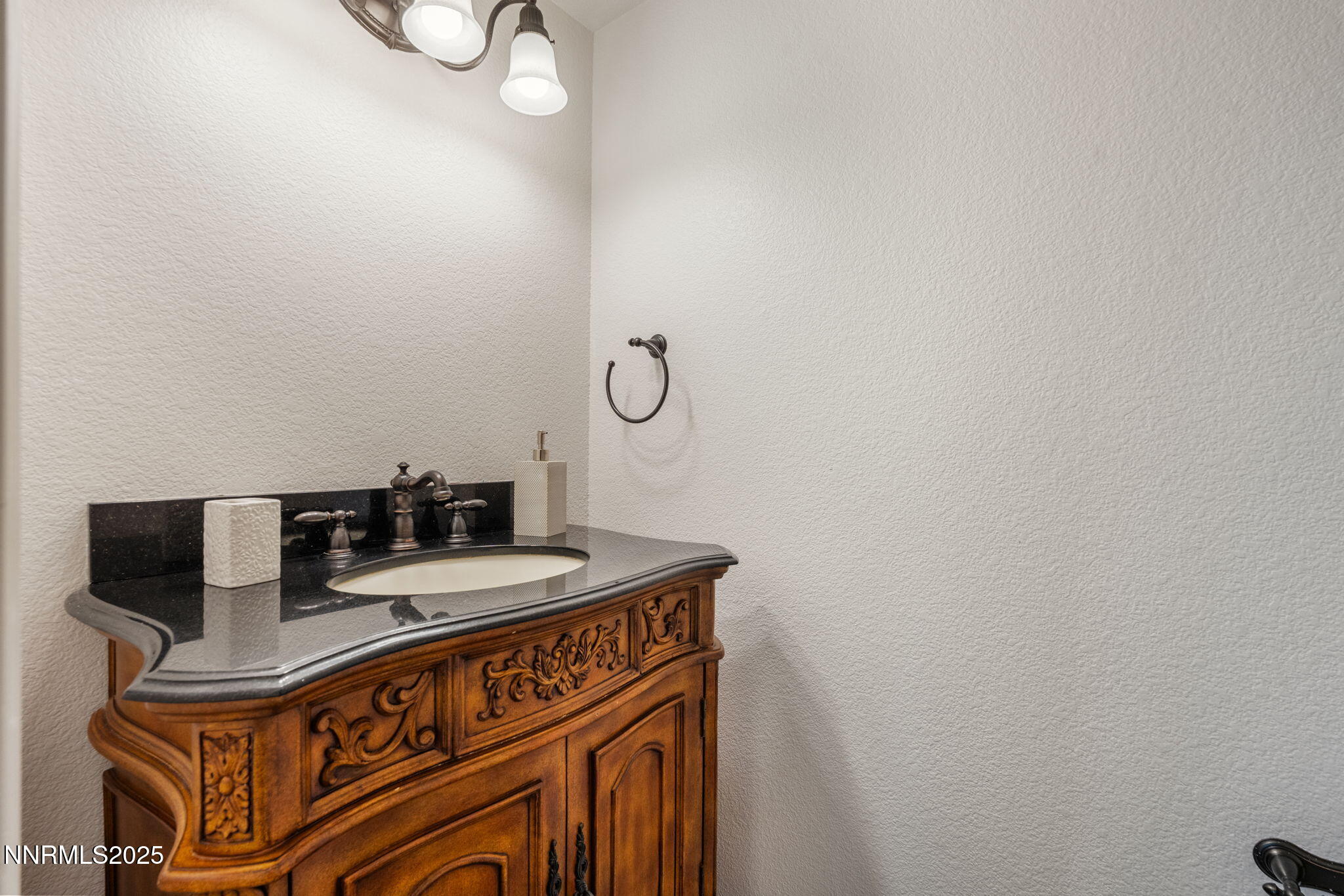 485 Corvallis Court Reno, NV 89511 - Photo 18 of 34 a bathroom with a sink and a mirror