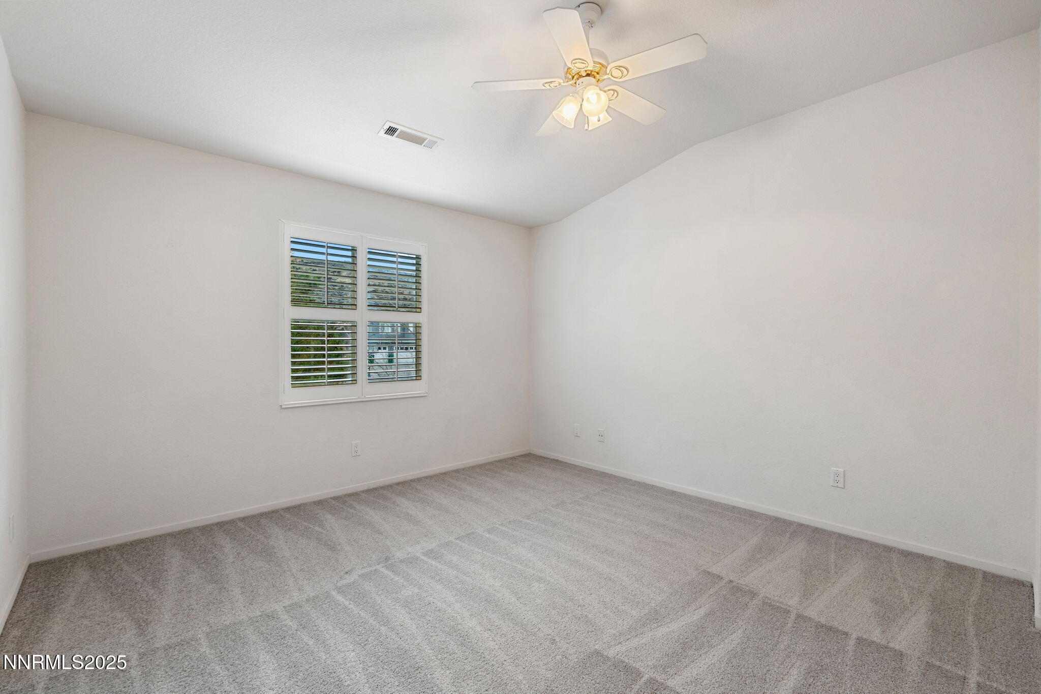 485 Corvallis Court Reno, NV 89511 - Photo 28 of 34 an empty room with windows and fan