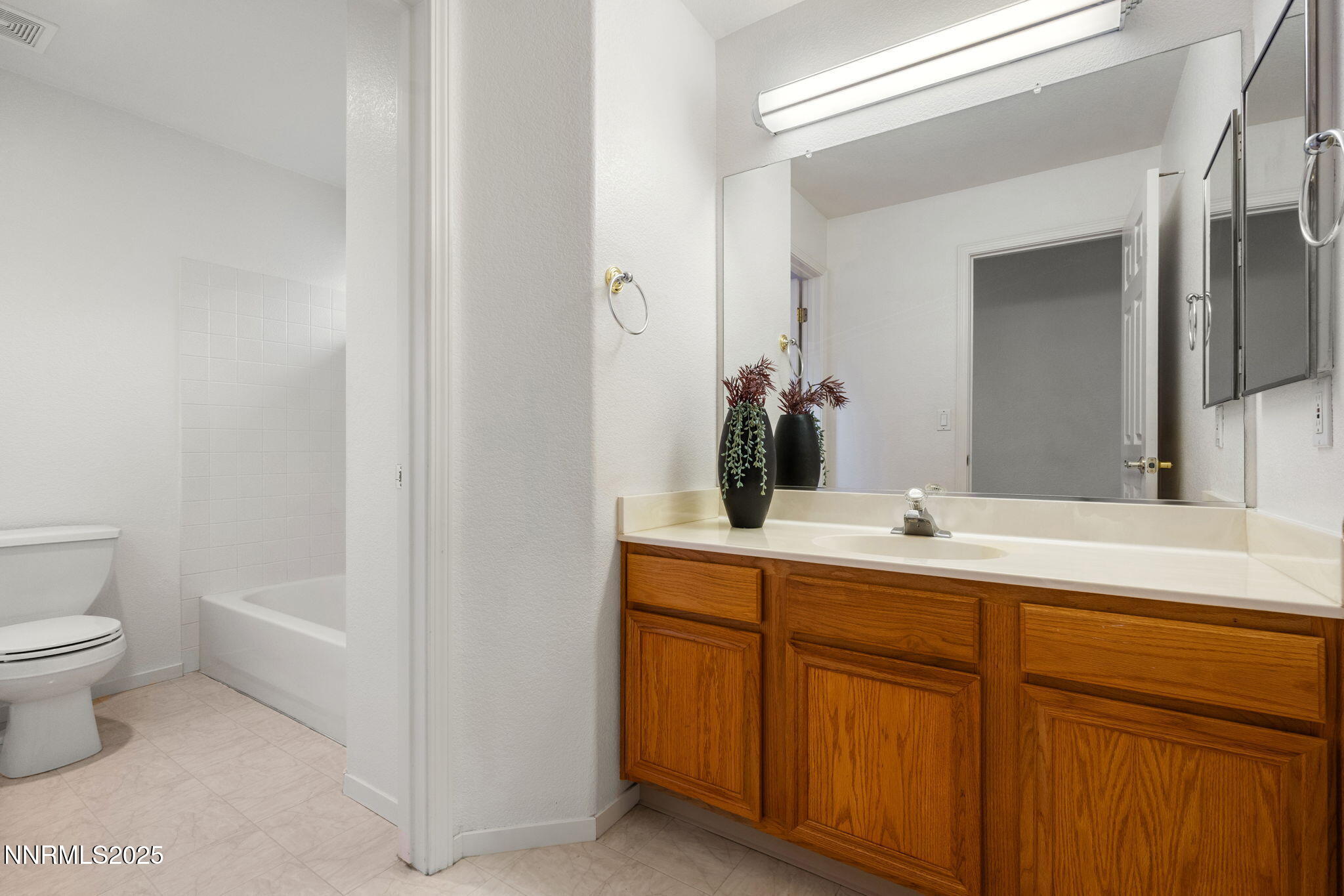 485 Corvallis Court Reno, NV 89511 - Photo 30 of 34 a bathroom with a toilet sink and mirror