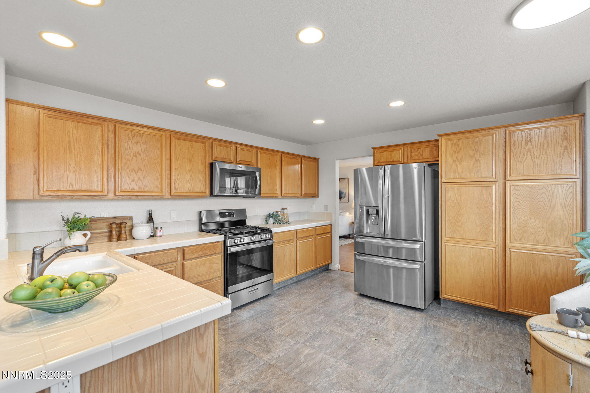 485 Corvallis Court Reno, NV 89511 - Photo 10 of 34 a kitchen with refrigerator and cabinets