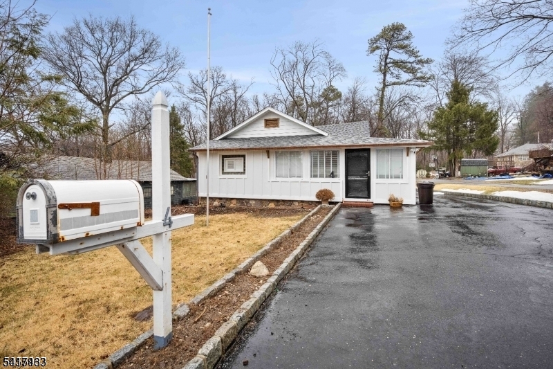 a view of a white house with a patio