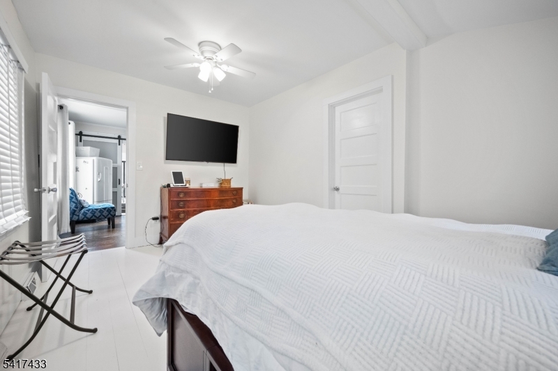 4 Dead End Road Newfoundland, NJ 07435 - Photo 18 of 24 a bedroom with a bed window and a flat screen tv