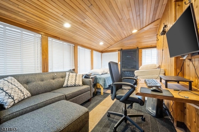 4 Dead End Road Newfoundland, NJ 07435 - Photo 22 of 24 a living room with furniture a flat screen tv and a window