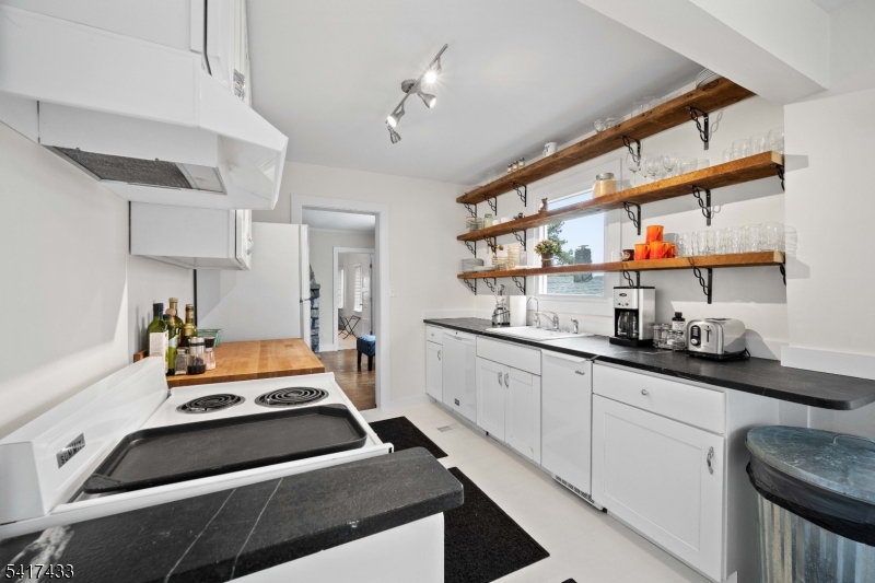 4 Dead End Road Newfoundland, NJ 07435 - Photo 10 of 24 a kitchen with stainless steel appliances a stove a sink and cabinets