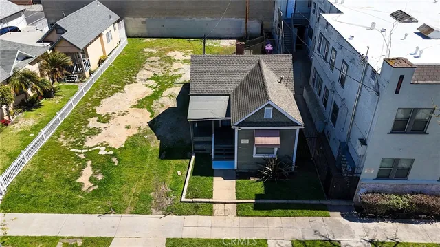 a picture of a building with a garden