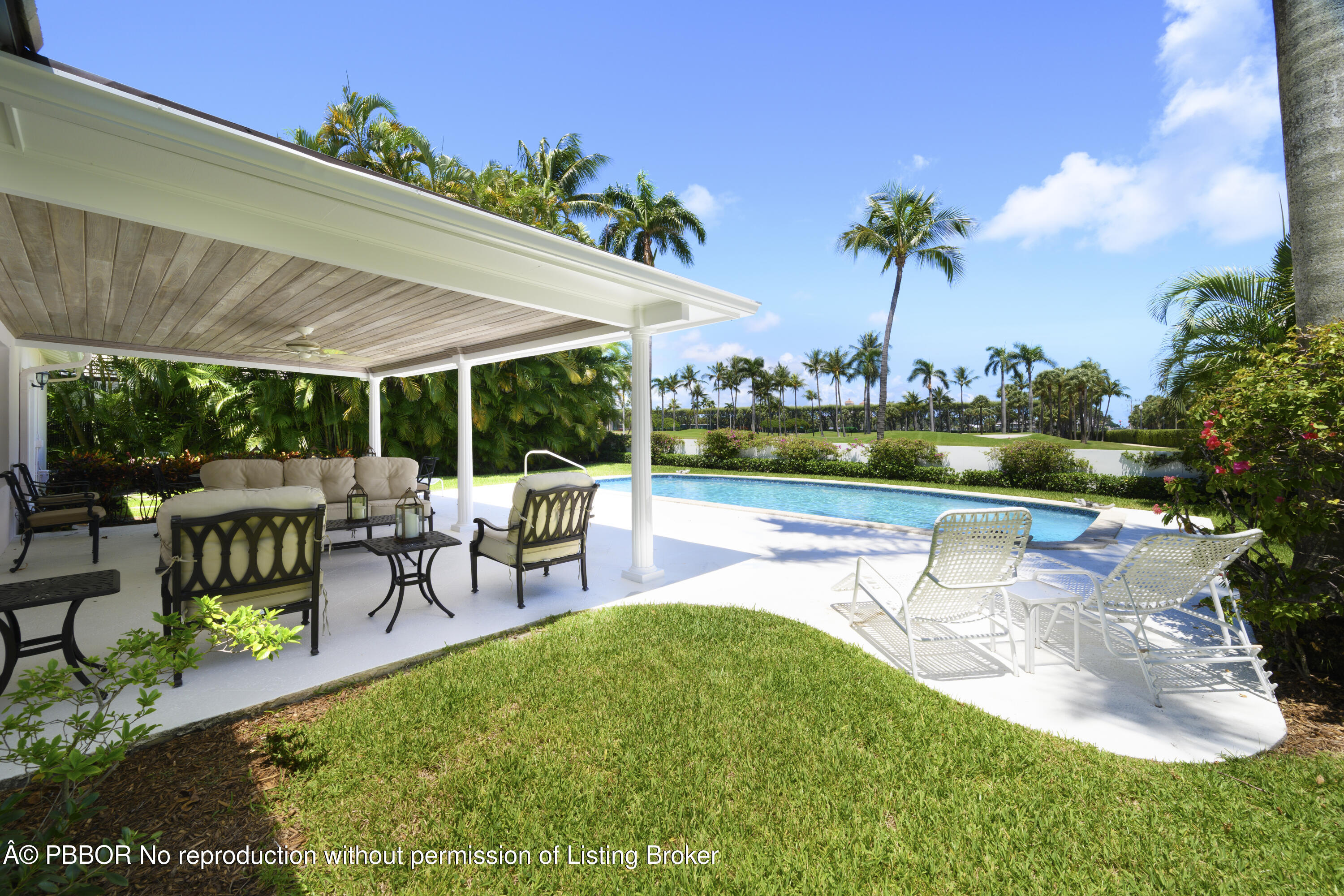 201 Pendleton Avenue Palm Beach, FL 33480 - Photo 1 of 22 a view of a patio with table and chairs potted plants and palm tree