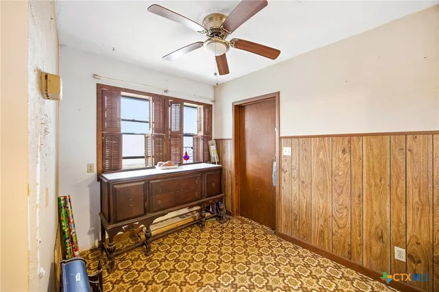 a view of a porch with wooden floor and a table