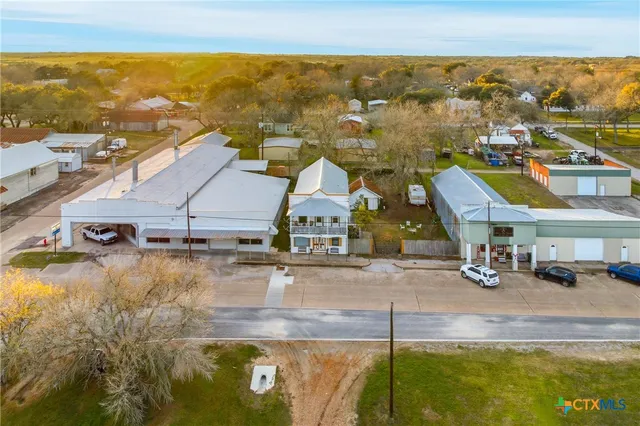an aerial view of residential building and ocean