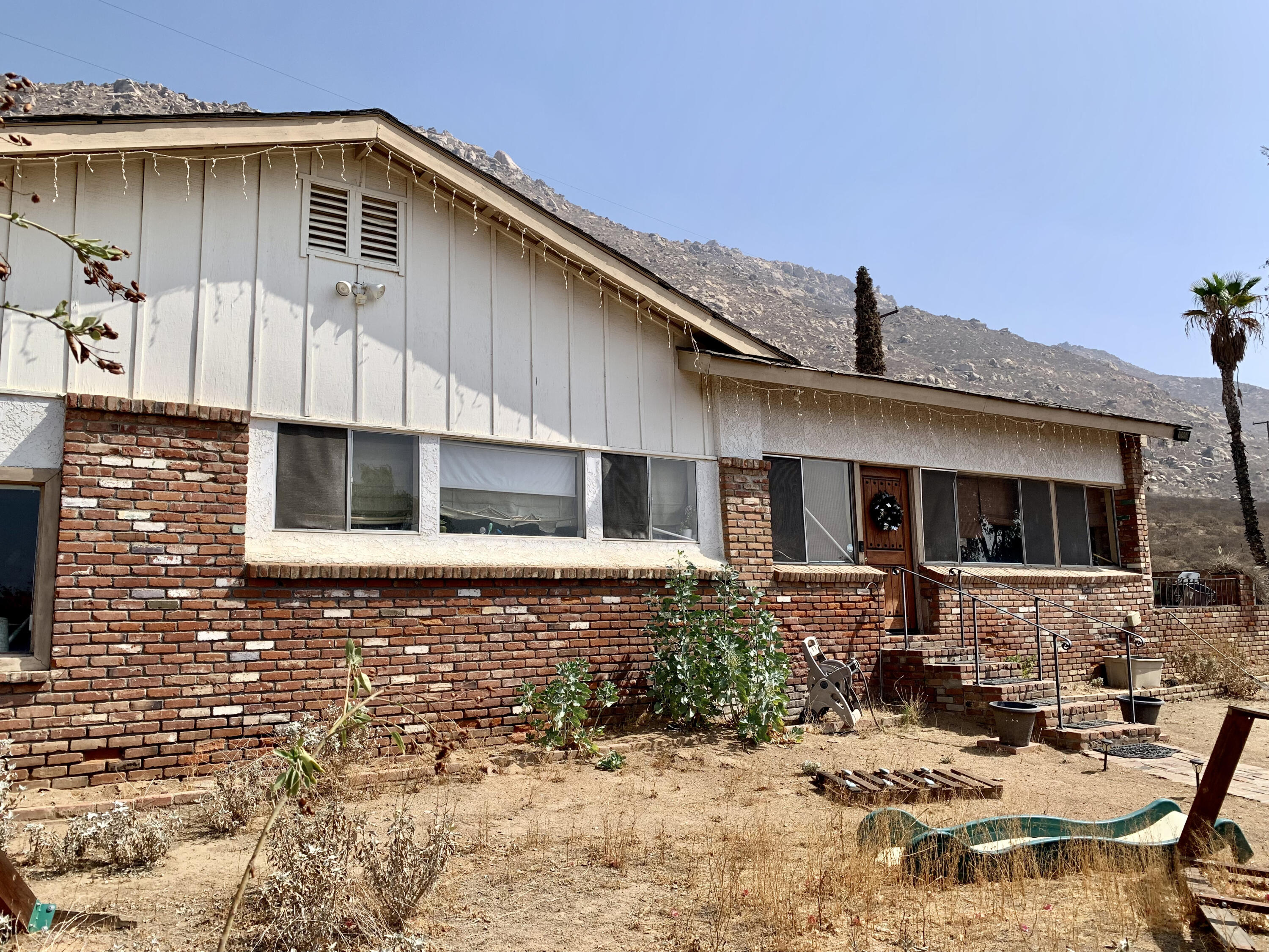 10968 Pettegrew Road Riverside, CA 92507 - Photo 12 of 14 a front view of a house with yard