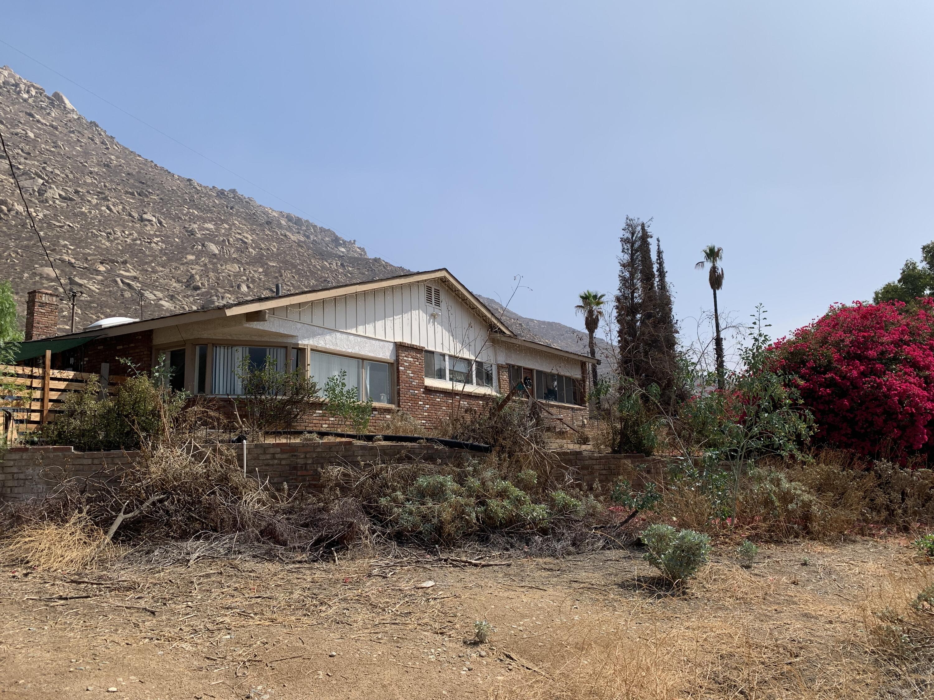 10968 Pettegrew Road Riverside, CA 92507 - Photo 13 of 14 a front view of a house with garden