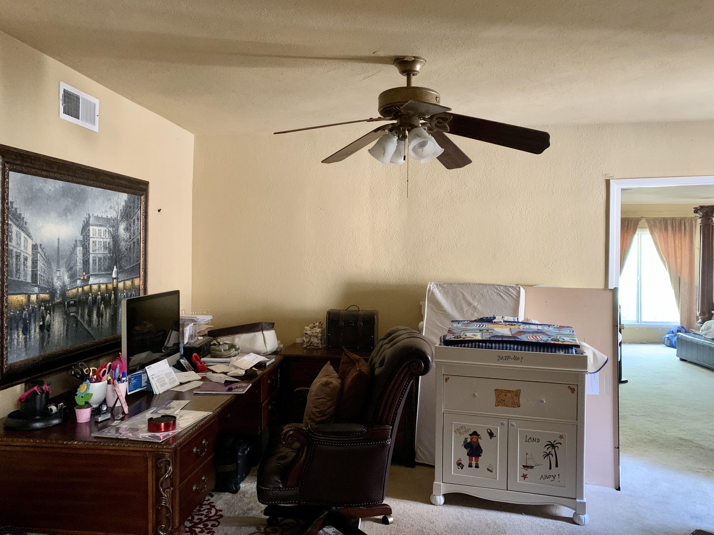 10968 Pettegrew Road Riverside, CA 92507 - Photo 3 of 14 a view of a workspace with furniture