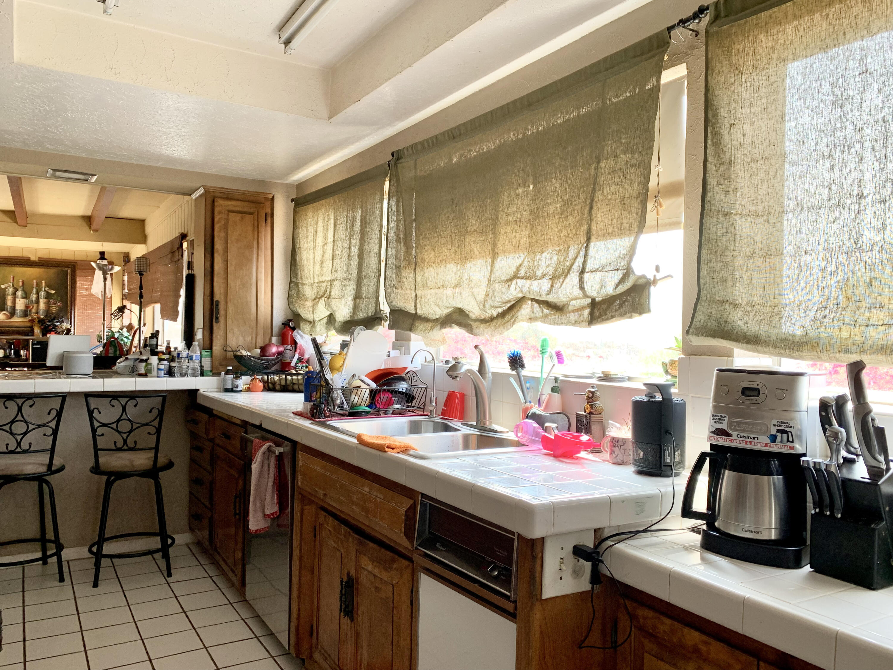 10968 Pettegrew Road Riverside, CA 92507 - Photo 6 of 14 a kitchen with a sink and cabinets