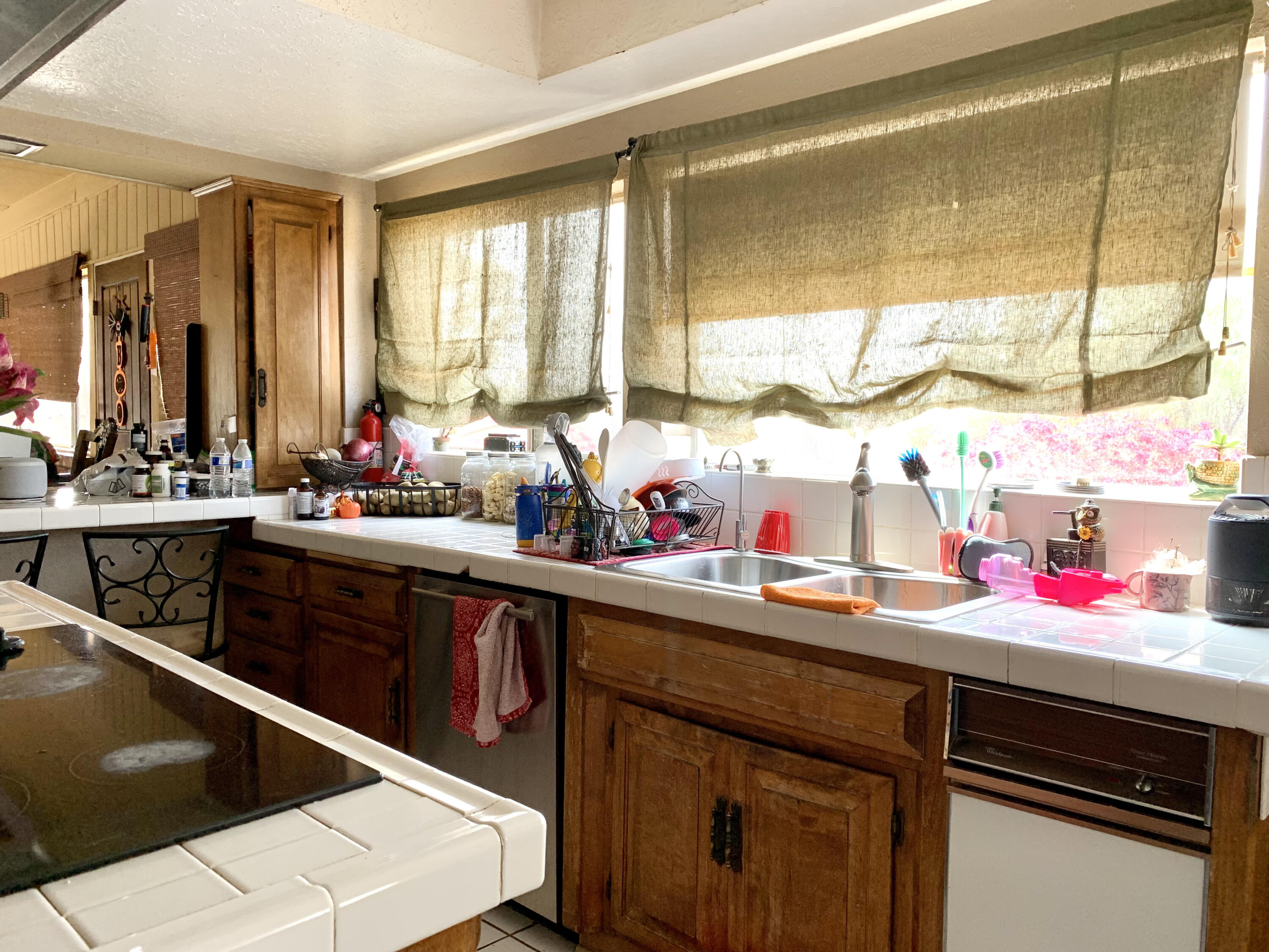 10968 Pettegrew Road Riverside, CA 92507 - Photo 7 of 14 a kitchen with a sink stove and cabinets