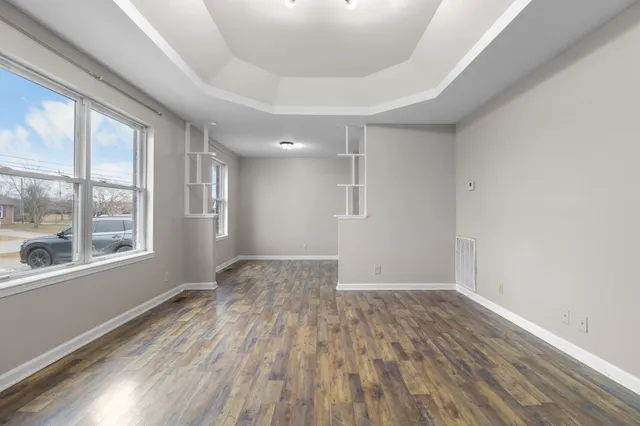 a view of a balcony with wooden floor