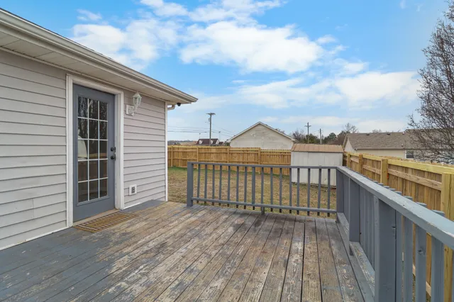 a view of outdoor space with wooden fence