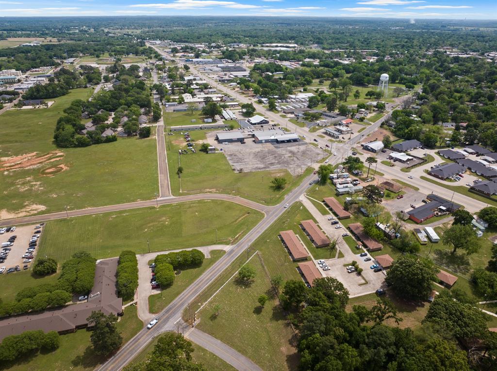 Tbd West 16th Street Mount Pleasant, TX 75455 - Photo 12 of 14 an aerial view of residential houses with outdoor space