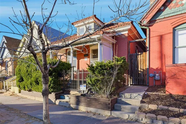 a view of a house with brick walls