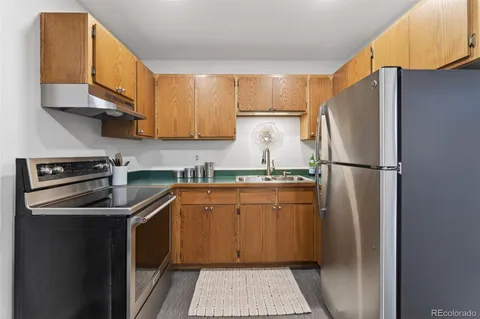 a bedroom with a bed and a lamp