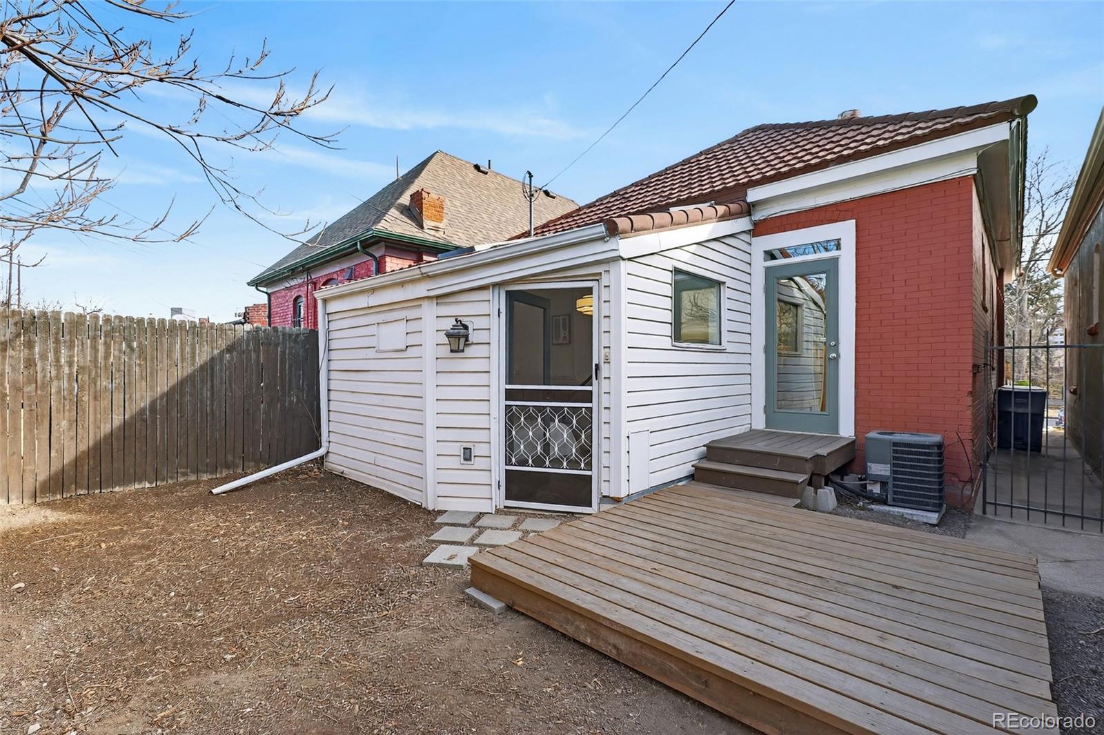 551 Cherokee Street Denver, CO 80204 - Photo 23 of 25 a front view of a house with parking space