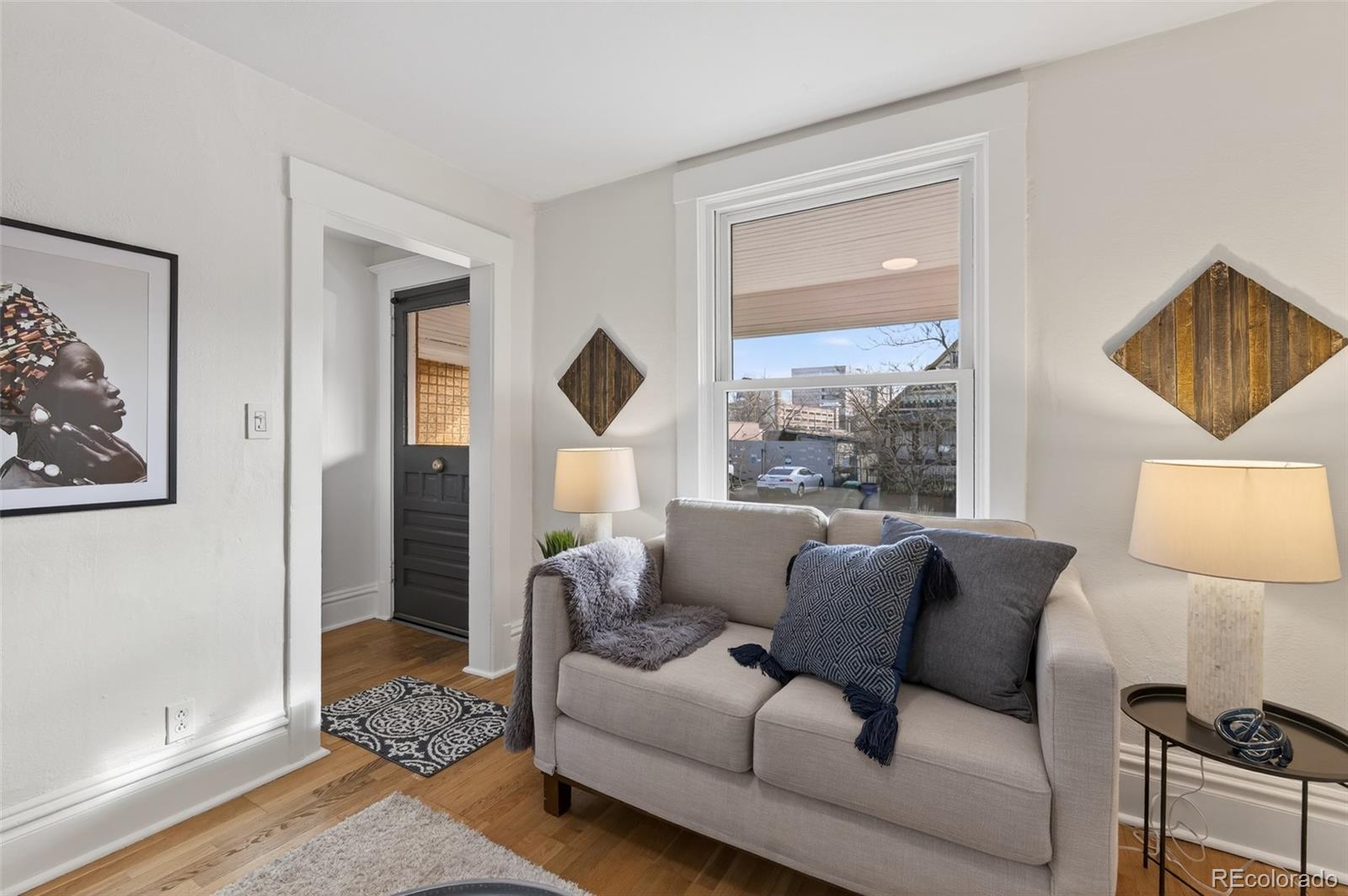 551 Cherokee Street Denver, CO 80204 - Photo 7 of 25 a living room with furniture and a window
