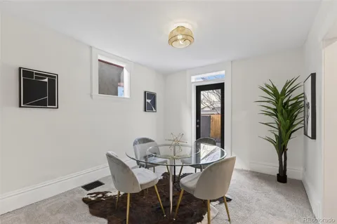 a kitchen with stainless steel appliances granite countertop a refrigerator a stove and a sink