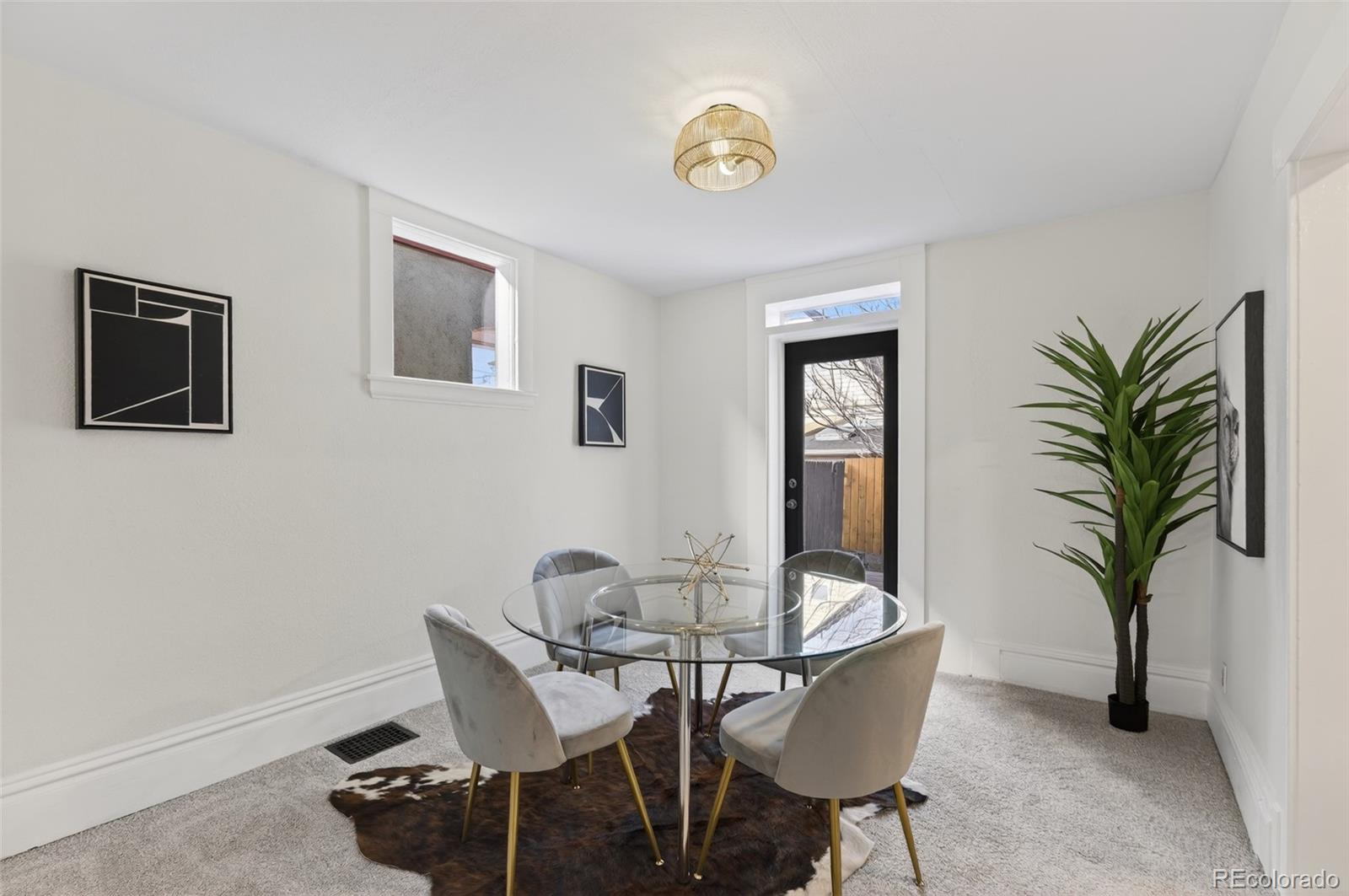 551 Cherokee Street Denver, CO 80204 - Photo 9 of 25 a view of a dining room with furniture and window